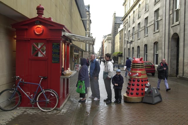 Gordon Thompson Director of The Californian Coffee Co. welcomes his first customer, Alec the Dalek , at the latest opening of his Police Box coffee stops in Rose Street.