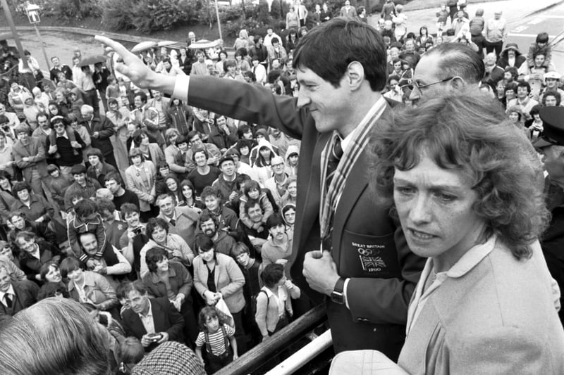 Scottish athlete Allan Wells (with wife Margot Wells) waves to the Edinburgh crowds from an open-topped bus in August 1980. Wells won an Olympic gold medal in Moscow for the 100m dash with a time of 10.25 seconds.
