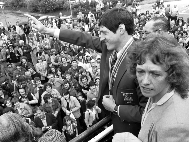 Scottish athlete Allan Wells (with wife Margot Wells) waves to the Edinburgh crowds from an open-topped bus in August 1980. Wells won an Olympic gold medal in Moscow for the 100m dash with a time of 10.25 seconds.