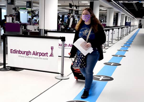 A passenger walking through Edinburgh Airport picture: JPI Media