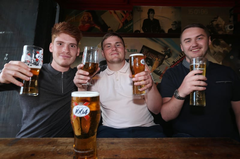 From left, Paolo Hamorak, Ryan Gisby and ryan Wiseman. Fans watch England v Ukraine in the quarter finals of Euro 2020, in The Kings pub, Albert Rd, Southsea. Picture: Chris Moorhouse (jpns 030721-12)