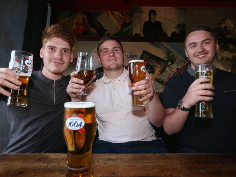 From left, Paolo Hamorak, Ryan Gisby and ryan Wiseman. Fans watch England v Ukraine in the quarter finals of Euro 2020, in The Kings pub, Albert Rd, Southsea. Picture: Chris Moorhouse (jpns 030721-12)