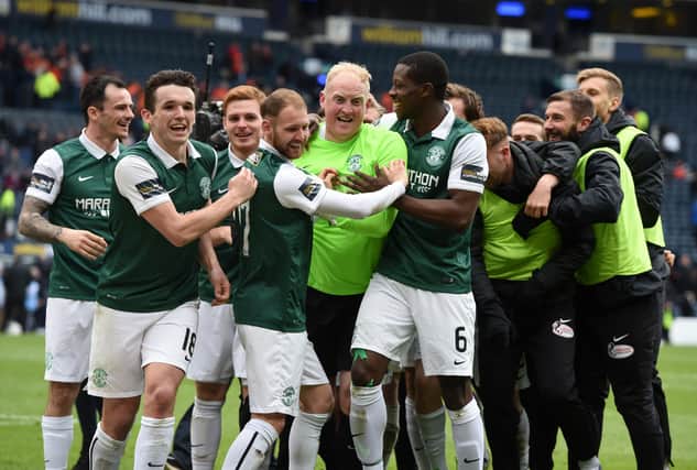 Conrad Logan (centre) is mobbed by Marvin Bartley and his Hibs team-mates after the semi-final win over Dundee United