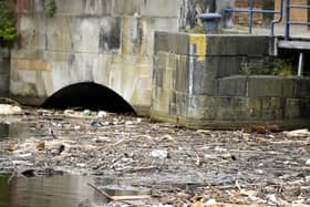 Rubbish and debris in the Water of Leith at the basin