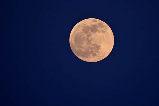 The full moon, seen here in Cagliari, Sardinia. Photo: Alberto PIZZOLI / AFP via Getty Images.
