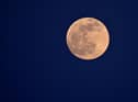 The full moon, seen here in Cagliari, Sardinia. Photo: Alberto PIZZOLI / AFP via Getty Images.