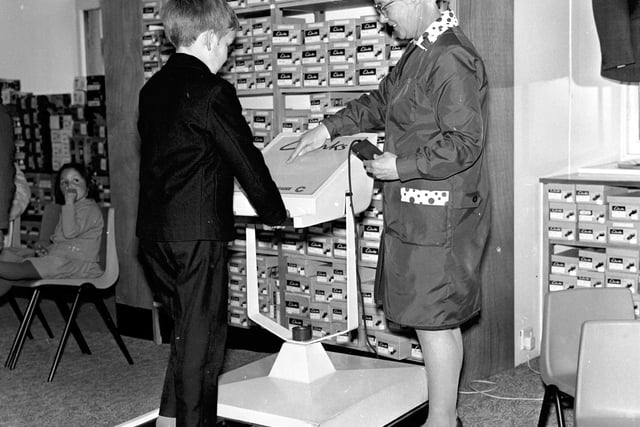 Baird's shoe stores could be found all over the Capital at one time. This young boy is having his feet measured at the South Bridge branch in 1971.