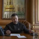 Ukrainian President Volodymyr Zelensky talks on the phone with US President Joe Biden