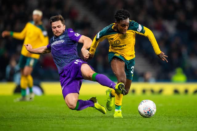 Stevenson battles for the ball with Celtic's Jeremie Frimpong