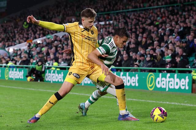 Livingston defender Jack Fitzwater puts in a challenge to halt the progress of Alexandro Bernabei at Celtic Park. Picture: Ian MacNicol/Getty