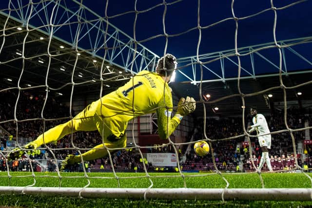 Craig Gordon plays match-winner as the Hearts keeper saves Ayo Obileye's penalty in the shootout. Picture: SNS