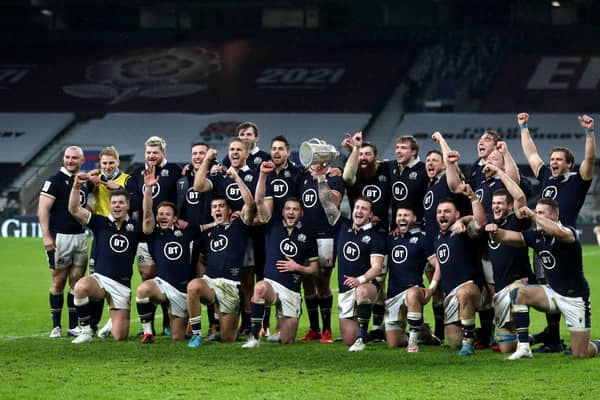 Scotland celebrate with the Calcutta Cup after the Guinness Six Nations match at Twickenham Stadium, London.
