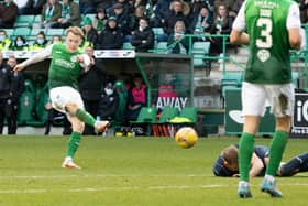 Harry Paton lies on the deck as Jake Doyle-Hayes fires in Hibs' opener in their 2-0 triumph over Ross County. Picture: SNS