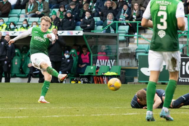 Harry Paton lies on the deck as Jake Doyle-Hayes fires in Hibs' opener in their 2-0 triumph over Ross County. Picture: SNS
