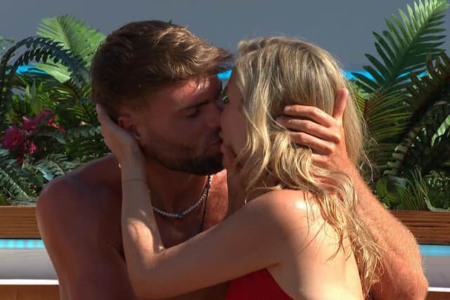 Tom and Sammy kiss during the challenge on Love Island (ITV)