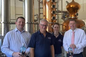 Staff at the Dark Art Distillery in Kirkcudbright with ‘Peggy’ the still
