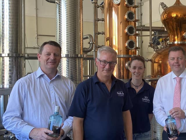 Staff at the Dark Art Distillery in Kirkcudbright with ‘Peggy’ the still