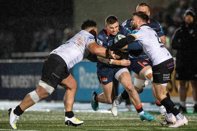 Edinburgh's James Lang is tackled by Glasgow's Ali Price during the inter-city clash at Scotstoun Stadium. Picture: Ross Parker / SNS