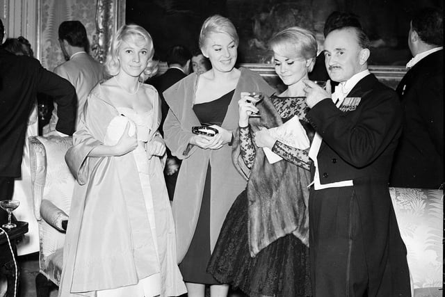Attendees at the 1958 Edinburgh Film Festival Ball in Hopetoun House - Neville Adams with French actresses Nicole Berger, Dominique Wilms and Noelle Adam.