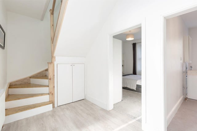 There is a beautifully crafted staircase leading to the upper level which is flooded by natural light from newly fitted Velux windows.