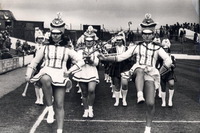 The combined drum majorettes giving a display of marching on the pitch before the start of the Barnsley v Huddersfield match   1978