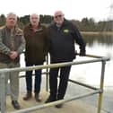 Millhall top brass (left to right) John Sneddon, manager. Jim Cowan, vice-president, and Andy Kirkham, president, with the lake behind them