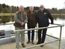 Millhall top brass (left to right) John Sneddon, manager. Jim Cowan, vice-president, and Andy Kirkham, president, with the lake behind them