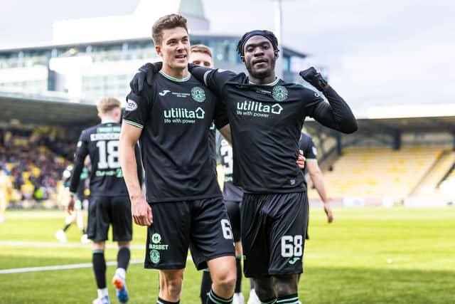 Élie Youan and Matthew Hoppe celebrate after combining for Hibs' second goal against Livingston