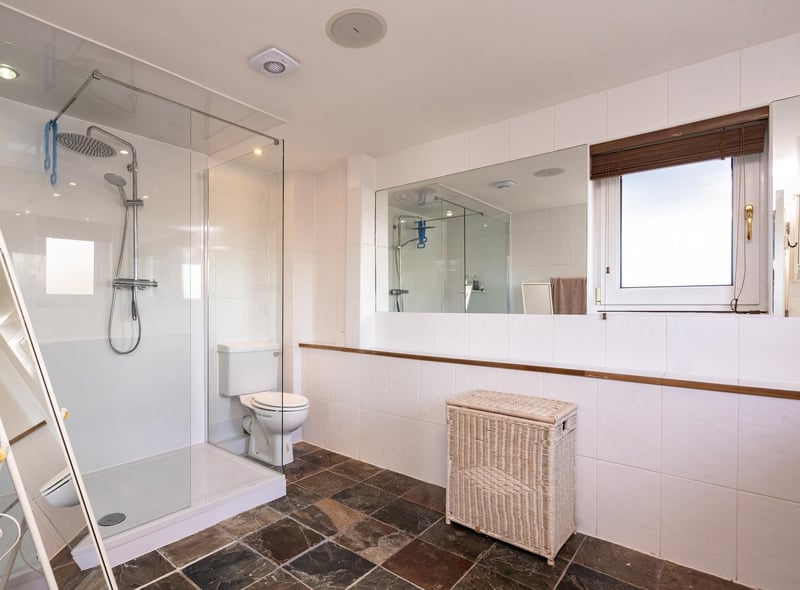 The master bedroom also enjoys access to a large en-suite shower room.