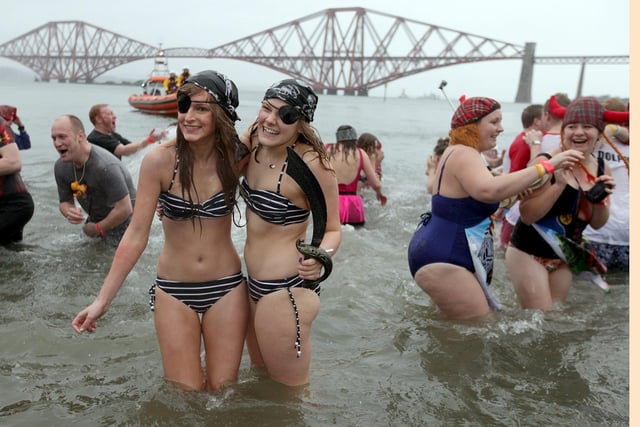 Around 1,000 people ran into the Firth of Forth from South Queensferry for the 2015 Loony Dook, many in fancy dress - like these two pirates.