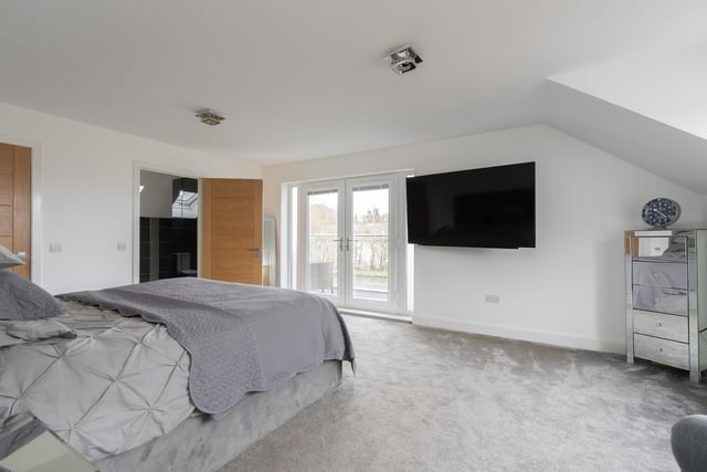 The large principal bedroom with walk in wardrobe, en-suite shower room and a west facing balcony with delightful canal views.