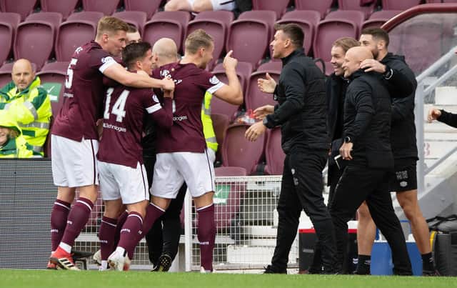 Hearts players and staff celebrate against Motherwell.