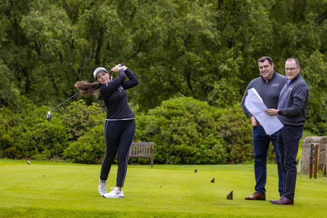 XBuro founders Thomas Brady and Michael Gribben with golfer Megan Docherty. Picture: Jeff Holmes
