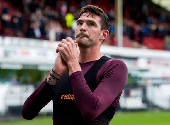 Hearts' Kyle Lafferty applauds the fans at the end of his final match