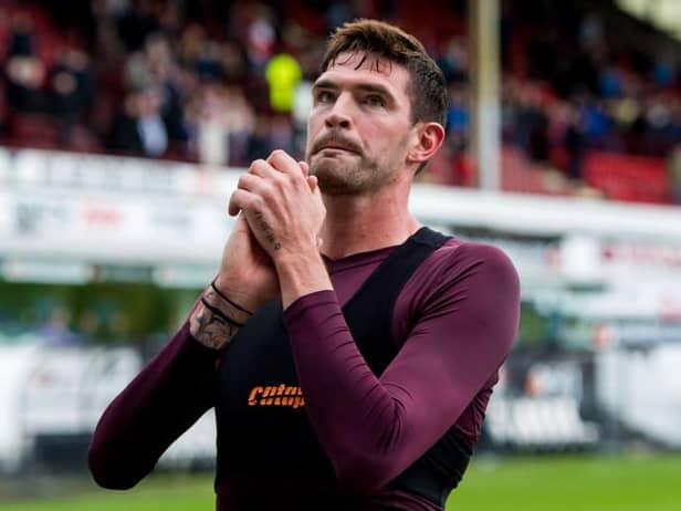 Hearts' Kyle Lafferty applauds the fans at the end of his final match