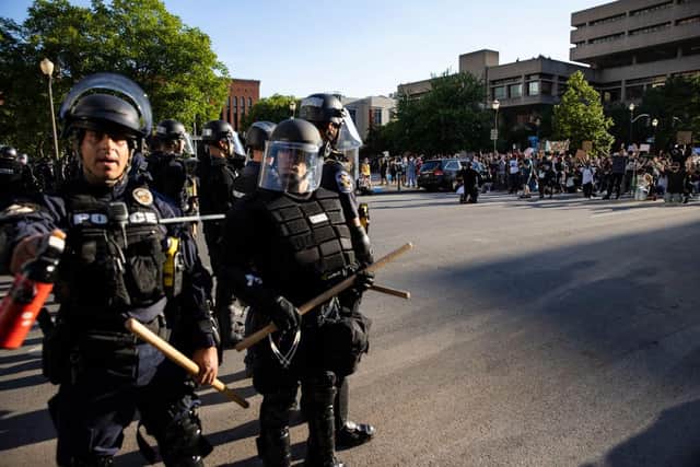 Police officers in riot gear stand across from protesters n Louisville, Kentucky (Photo: Brett Carlsen/Getty Images)