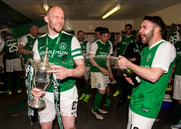 James Keatings celebrates winning the league title with David Gray in May 2017