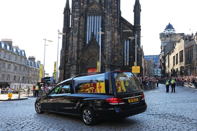 The hearse carrying the coffin of Queen Elizabeth II departs St Giles' Cathedral, for Edinburgh Airport, where was flown by the Royal Air Force to RAF Northolt.