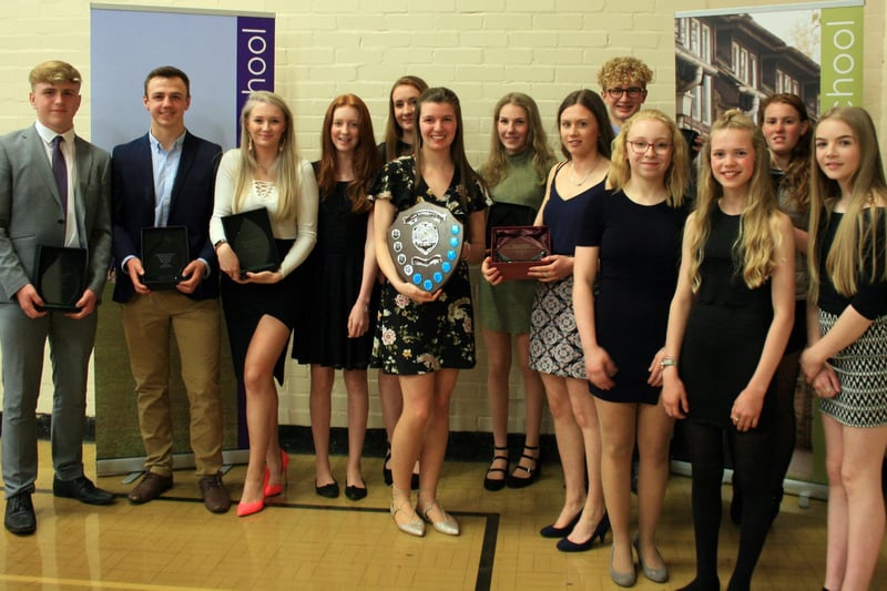 Proof that hard work earns results in this photo of sports awards winners in 2018.