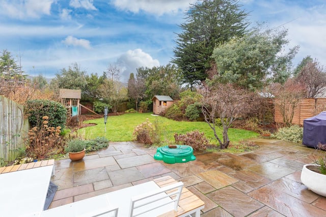 The stunning enclosed south-west facing rear garden complete with manicured lawn, established plants, patio and decking area perfect for family time or entertaining friends. It also features a useful log store.