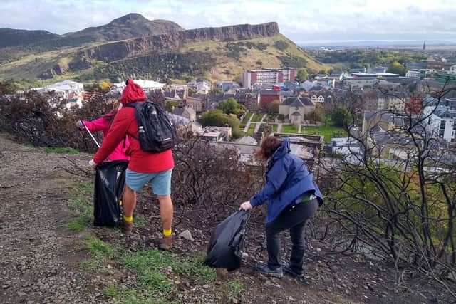 Nat-West employees and Real3Peaks Challenge representatives on Calton Hill picking up litter.