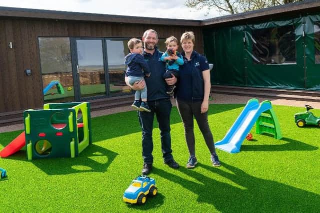 The Brown family out enjoying the green play area at Lazy Lawn Scotland’s offices and show garden in Penicuik.