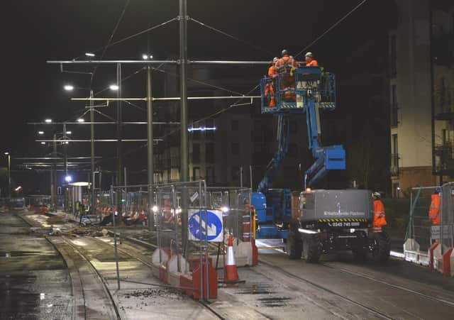 Engineers check the tension in the overhead electric wires near the Port of Leith tram stop on Ocean Drive.   Picture: Robert Drysdale.