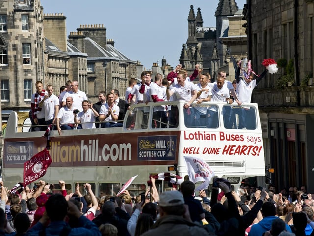 Hearts fans gather on the Royal Mile to celebrate there team winning the Scottish cup in 2012 with their open top bus parade to Tynecastle