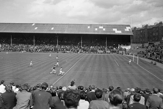 Crowds watch Hearts take on Kilmarnock at Tynecastle in June 1965, with a view of the recently-extended 18-yard line.