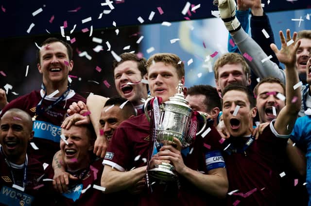 Marius Zaliukas lifts the Scottish Cup after Hearts' 5-1 win against Hibs in 2012