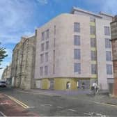 The block of student flats has been reduced from six to five storeys, but councillors said it was still 'overbearing'.