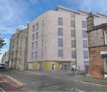 The block of student flats has been reduced from six to five storeys, but councillors said it was still 'overbearing'.