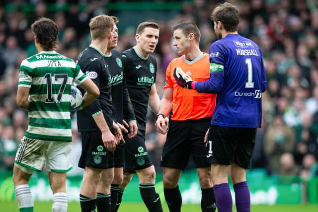 Hibs players appeal to referee Steven McLean during Saturday's contentious 3-1 loss to Celtic in Glasgow. Picture: SNS