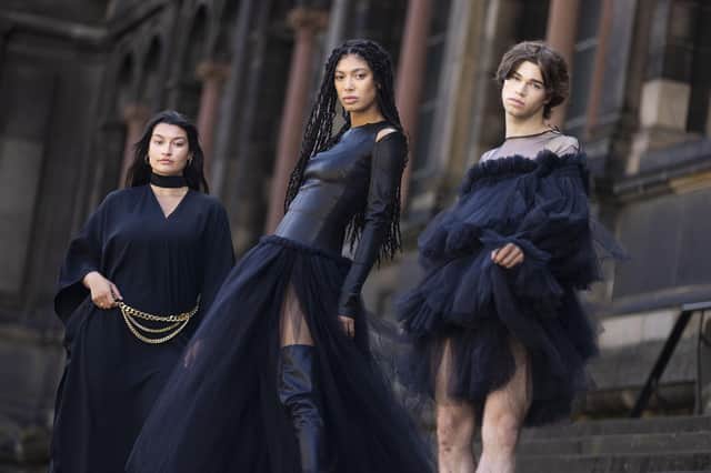 Models Shannon Summers, Grace Dempsey and Joshua Cairns pose outside the National Museum of Scotland ahead of the opening of Beyond the Little Black Dress